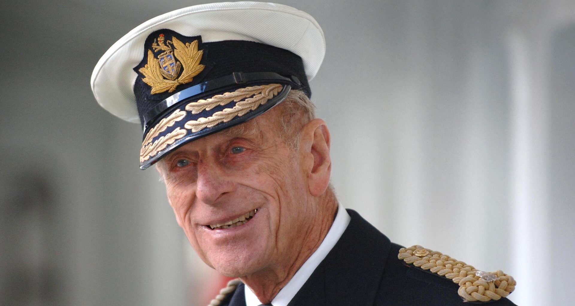 Prince Philip smirks while wearing his military uniform