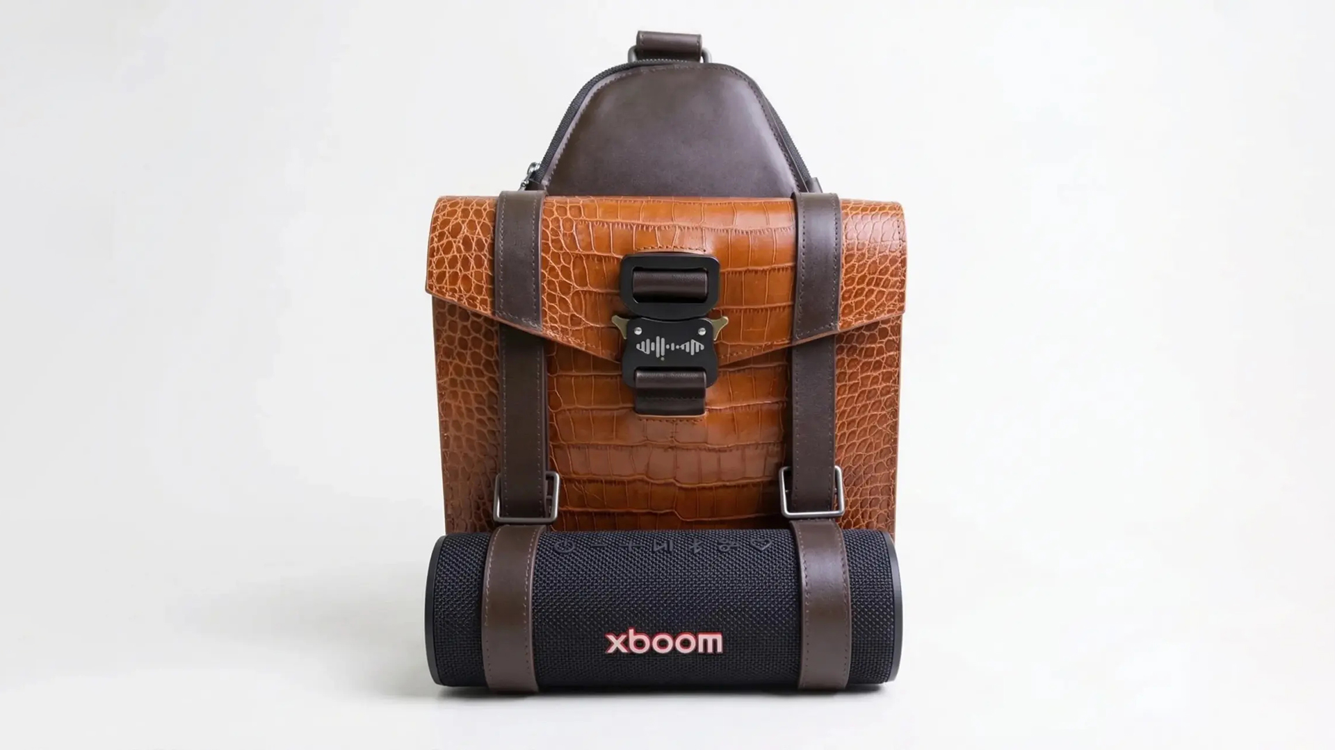 will.i.am's boombag, a backpack in crocodile-skin leather with an LG xboom strapped to the bottom