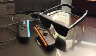Xreal display glasses next to Nintendo Switch 2 on a table