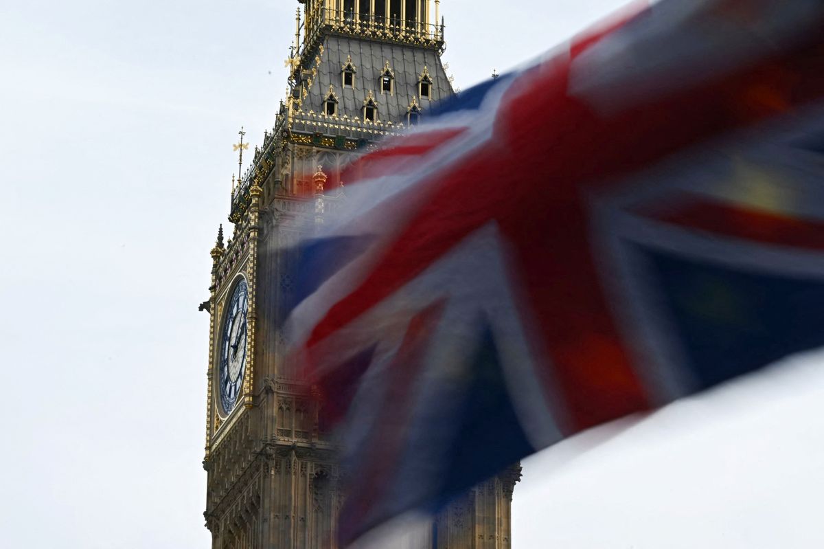 Union Jack flag with behind a European Union flag flapping in the air in front of Big Ben