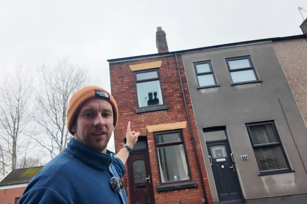 David Burnip pointing at a property