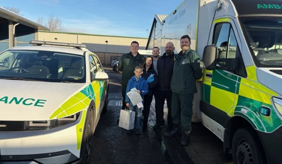 Christopher, 9, with dad Lee and wife Catriona and paramedics
