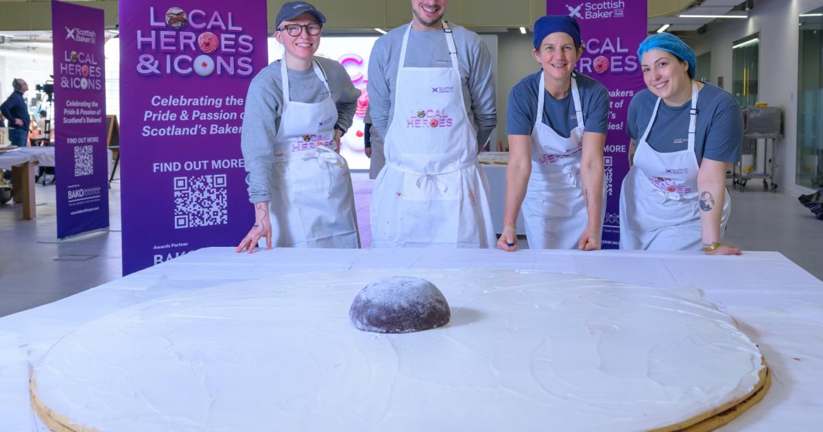 Company Bakery donate giant Empire biscuit to foodbank