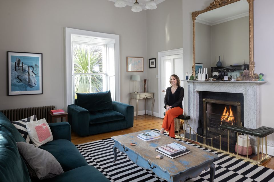 Nutritional therapist Amy Swan in the elegant living room of her period home in south county Dublin. The room has lovely original features, including high ceilings, mouldings and mantelpiece. Photo: Tony Gavin