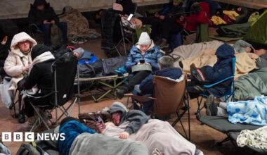 People take shelter at a metro station during a Russian air attack, in Kyiv, on early February 3, 2026.