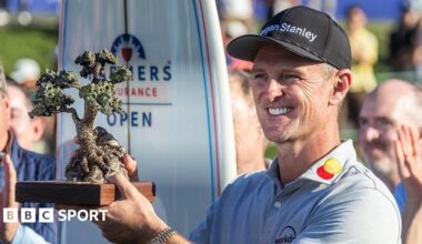 Justin Rose is presented the Championship trophy after winning the Farmers Insurance Open