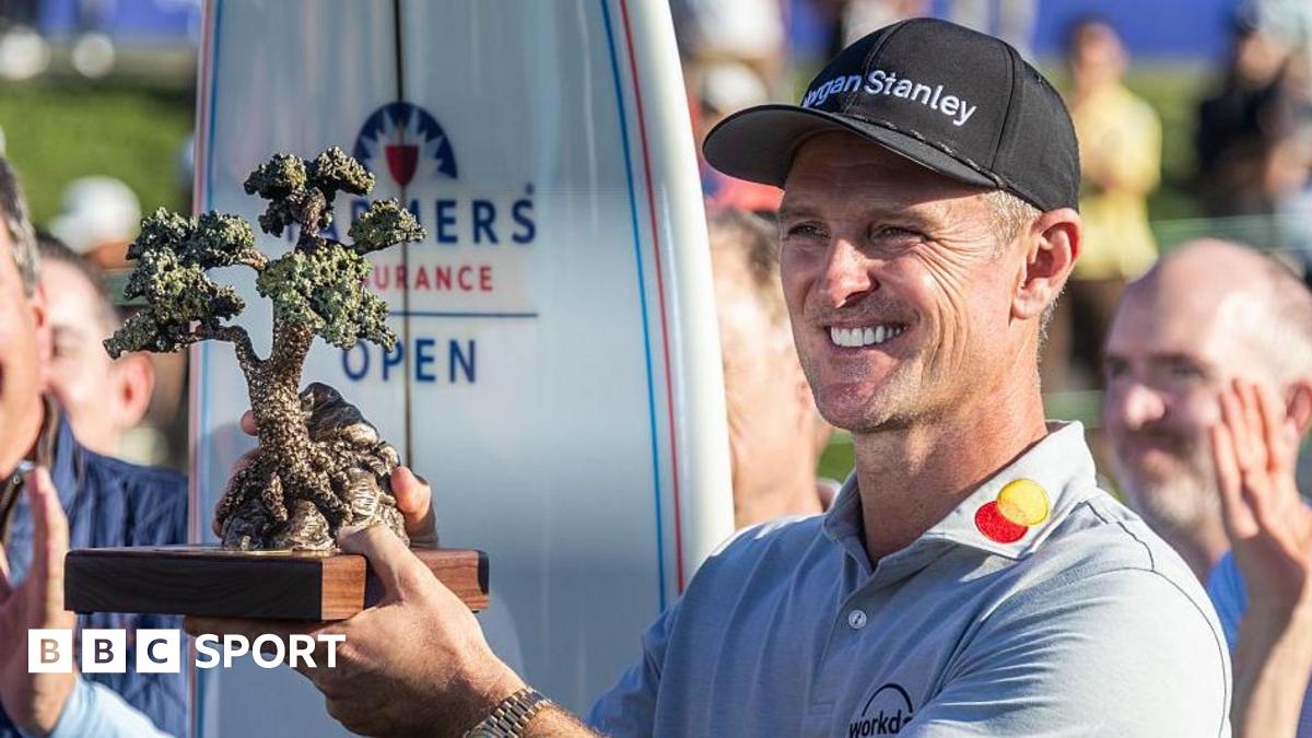 Justin Rose is presented the Championship trophy after winning the Farmers Insurance Open
