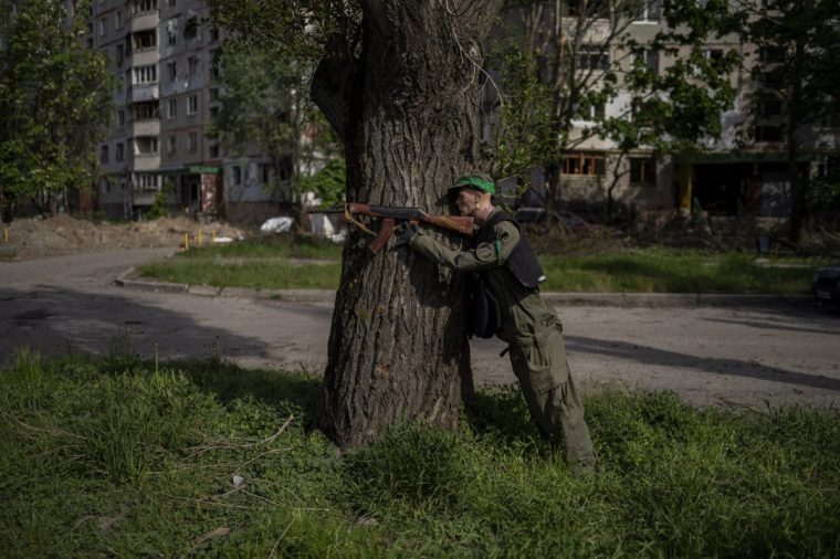 A mannequin dressed as a soldier is placed near a road in north Kharkiv, Ukraine, Friday, May 13, 2022. (AP Photo/Bernat Armangue)