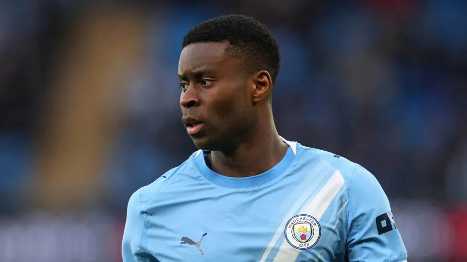 Marc Guehi looks on while in action for Manchester City