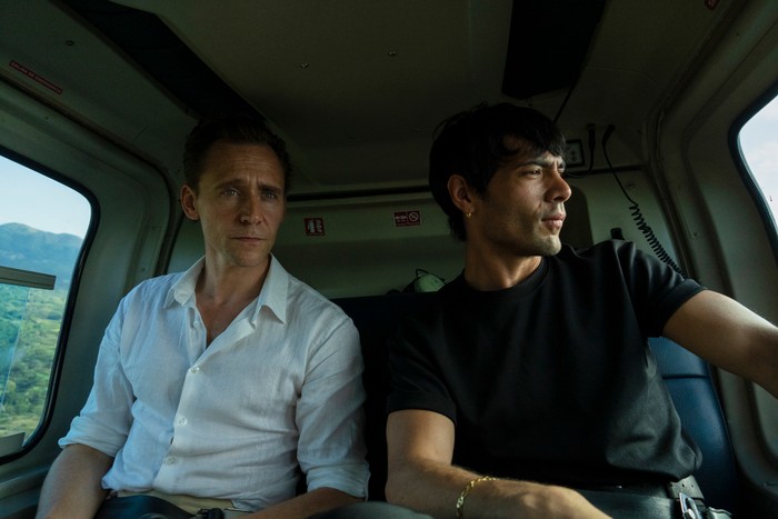 Tom Hiddleston and Diego Calva star in The Night Manager season 2; in this scene, Jonathan and Teddy are sat in a helicopter, looking out the windows