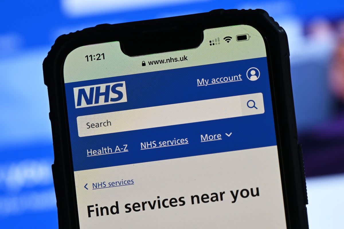 The National Health Service (NHS) app displayed on a mobile phone screen (JUSTIN TALLIS/AFP via Getty Images)