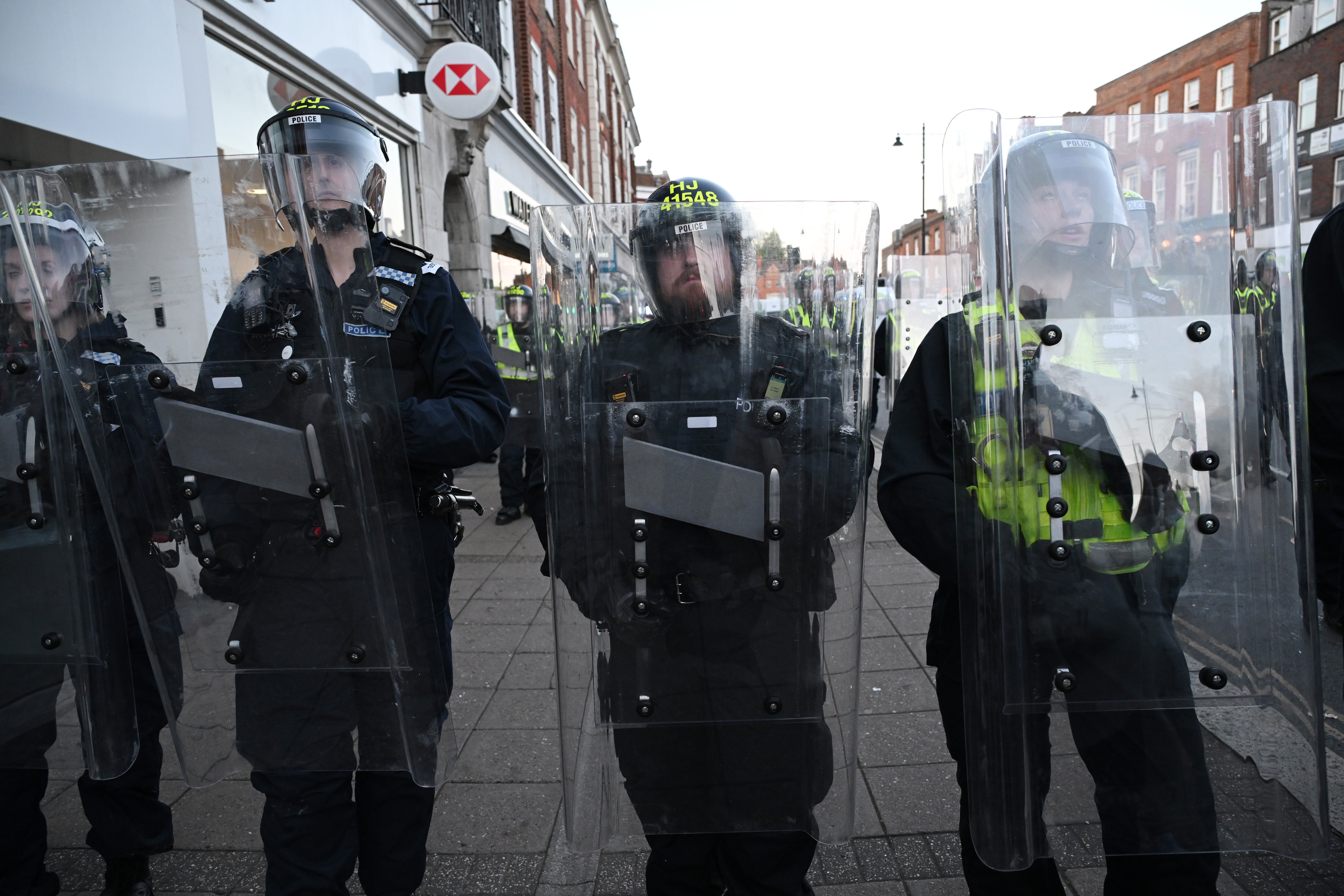 Dozens of police officers could be seen wearing helmets and holding shields, with objects appearing to have been thrown at them