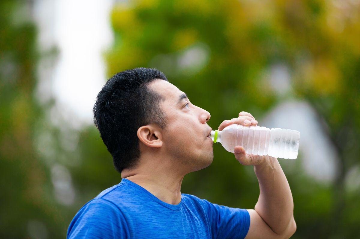 Man drinking water in heatwave