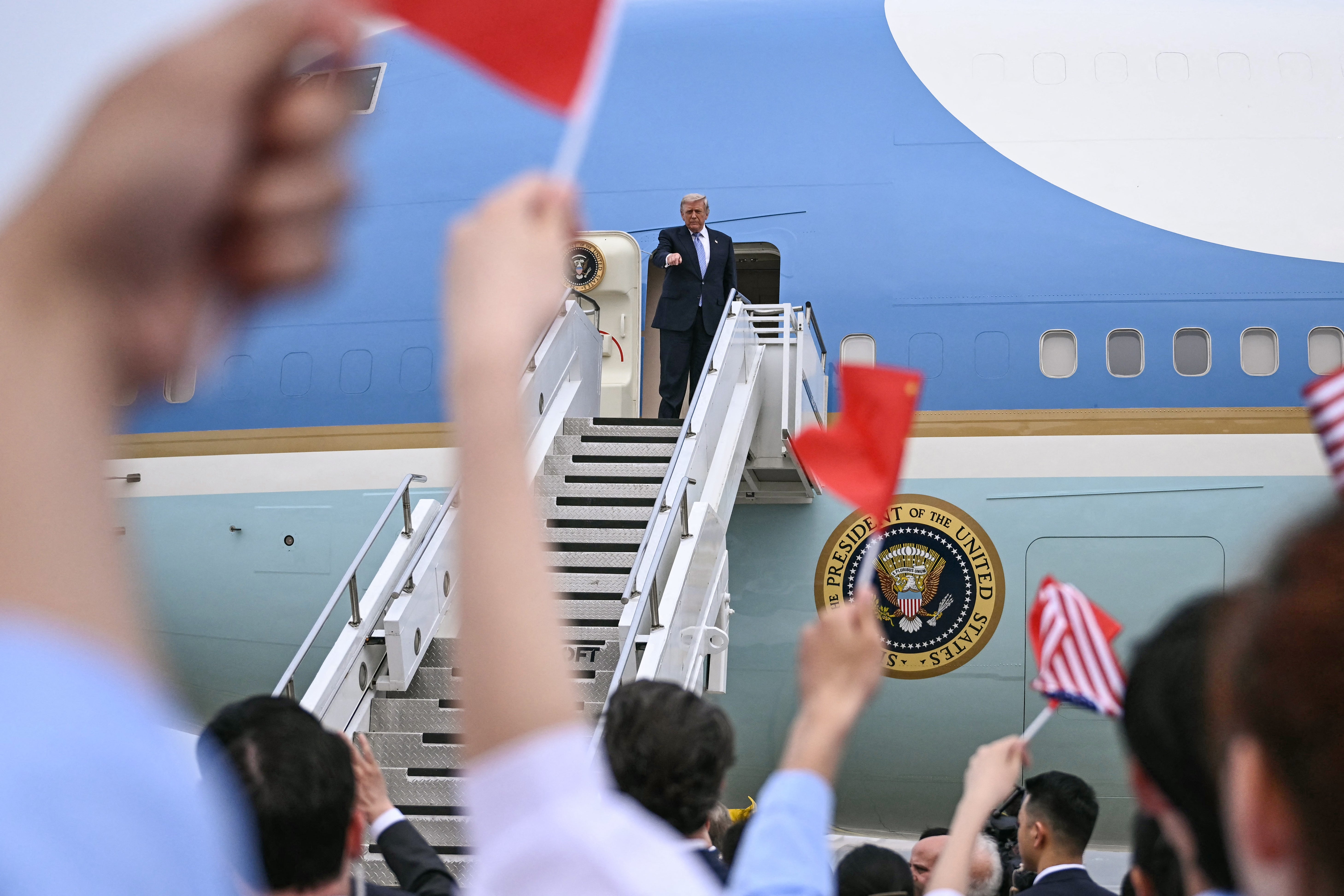 Donald Trump boards Air Force One before his departure from Beijing Capital Airport in Beijing on May 15