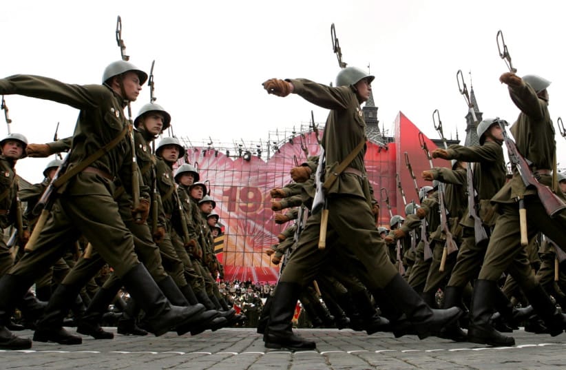 Russian soldiers dressed in former Soviet Union's Red Army uniforms march during the military parade on Red Square in Moscow, May 9, 2005.