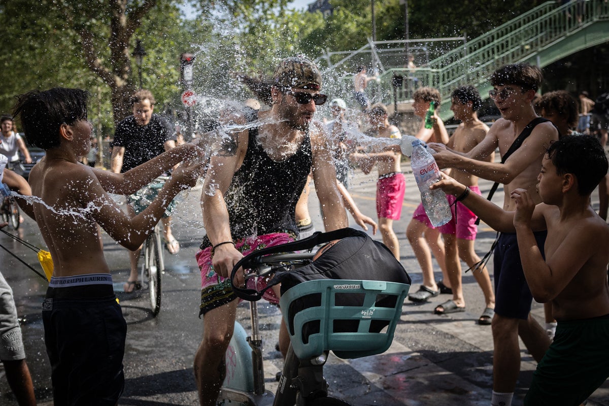 Paris imposes alcohol bans as 40C heatwave leads to scores of deaths in France