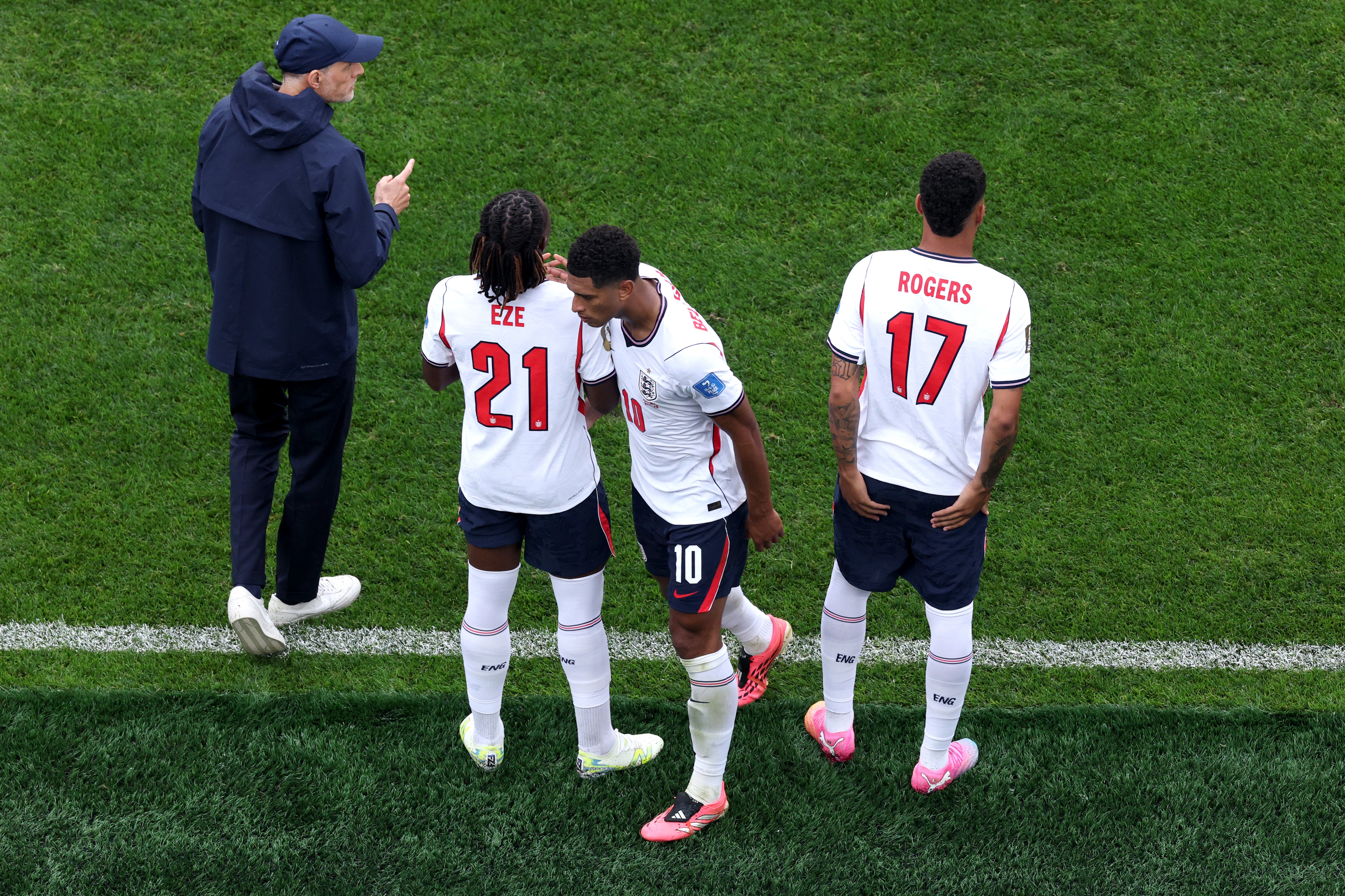 Jude Bellingham embraces Eberechi Eze and Morgan Rogers after being substituted