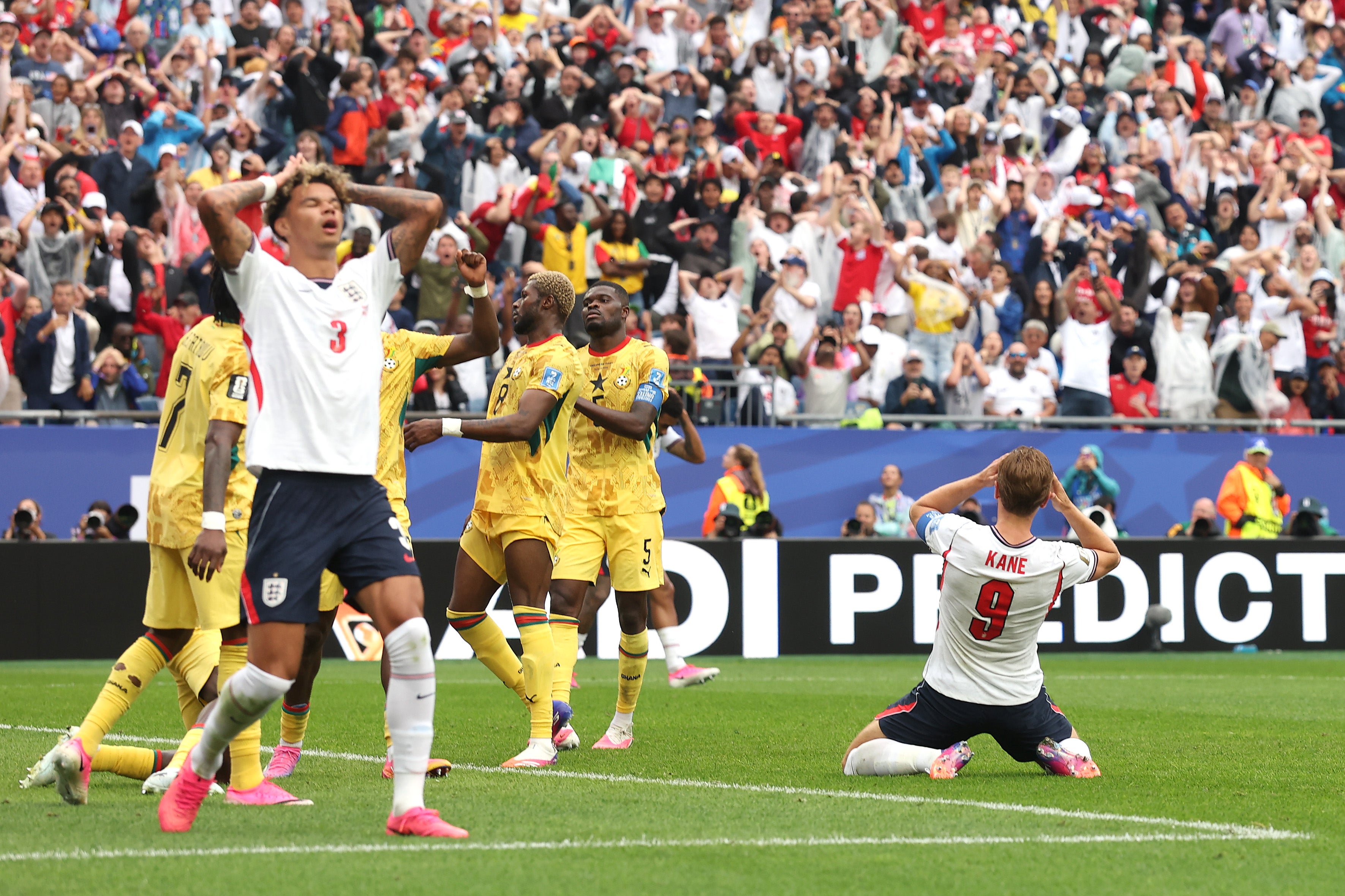 Nico O'Reilly and Harry Kane of England react after a missed chance