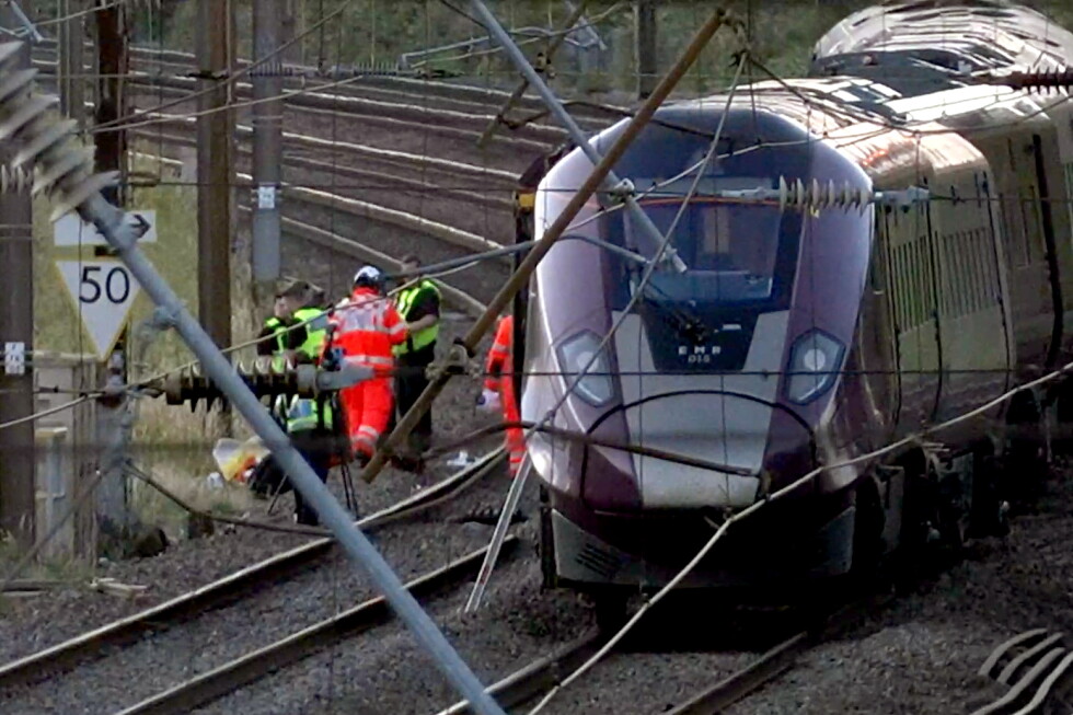 Emergency services respond to a collision of trains north of London that killed 1