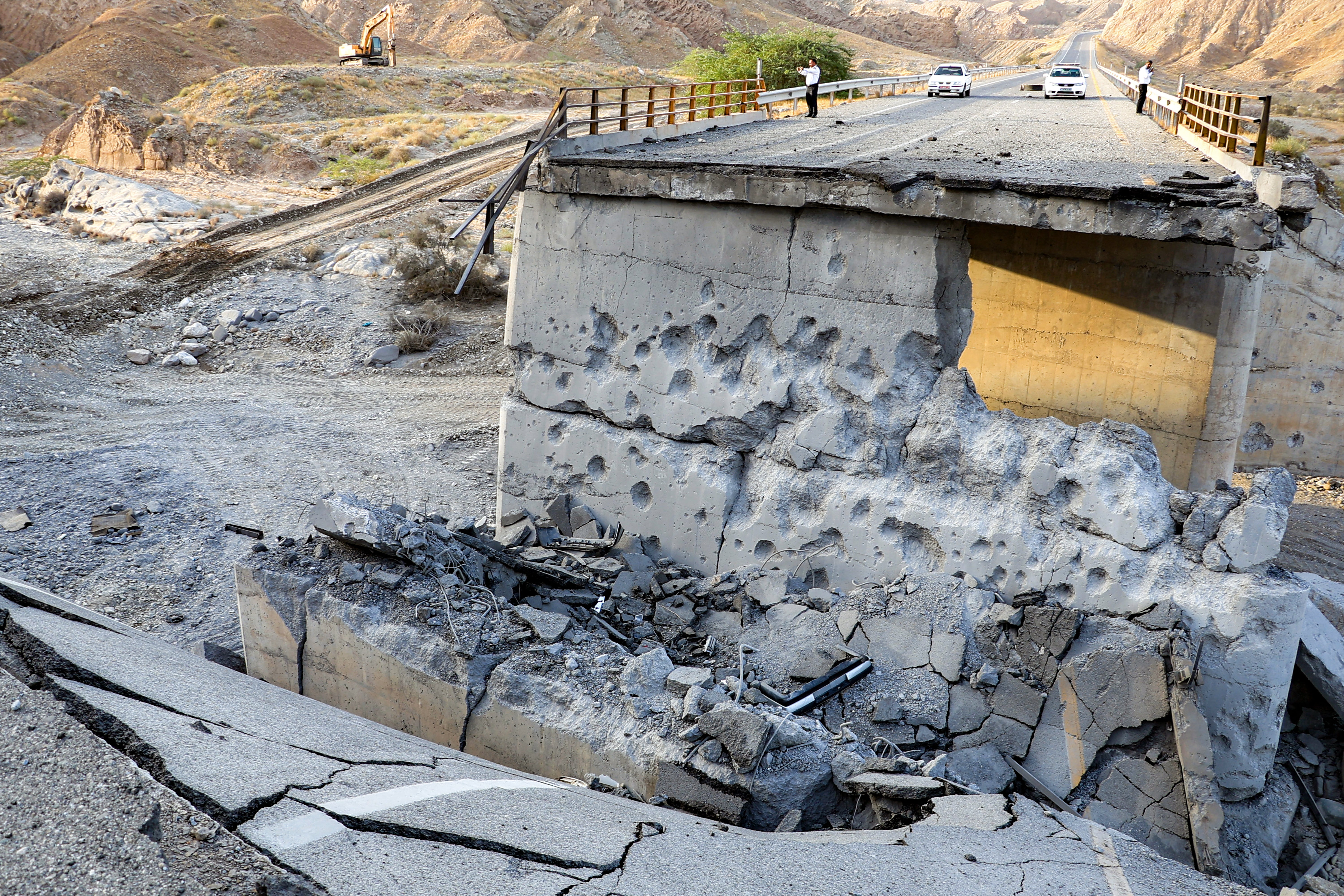 A heavily-damaged bridge which was hit by a US strike is pictured along the road connecting Roudan and Bandar Abbas in southern Iran on July 18, 2026.