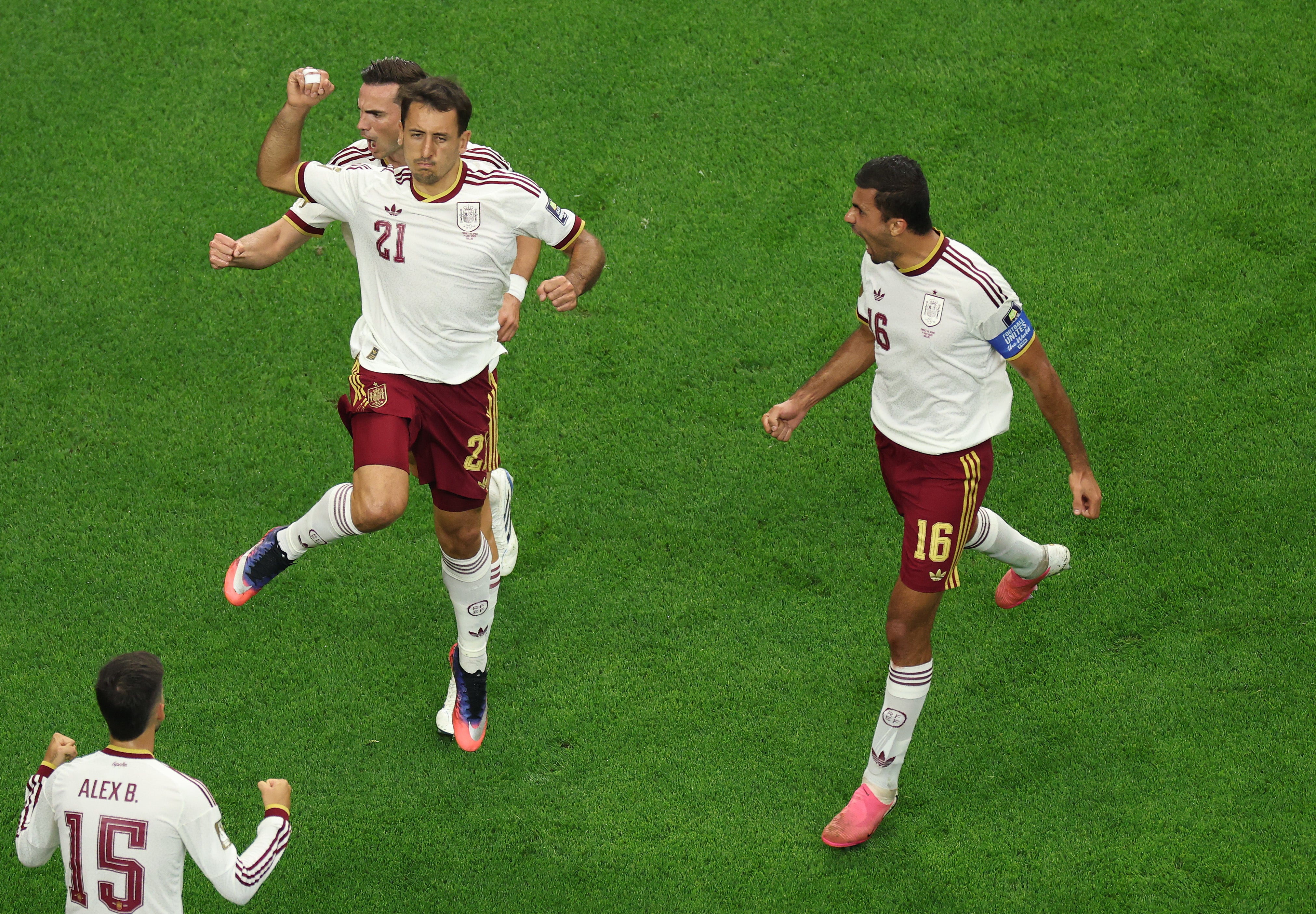 Mikel Oyarzabal of Spain celebrates with teammates after converting a penalty