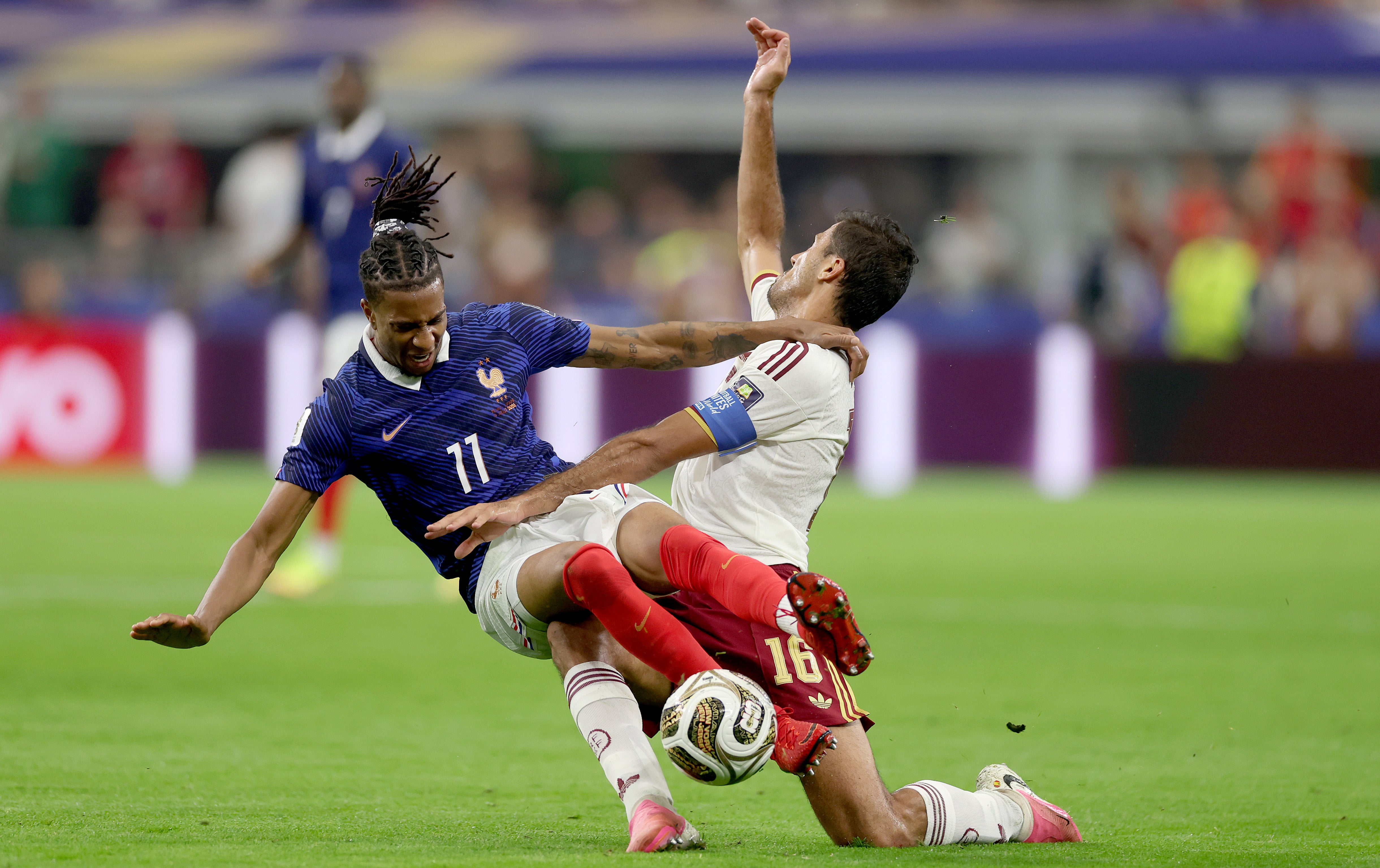 Michael Olise of France is challenged by Rodri of Spain
