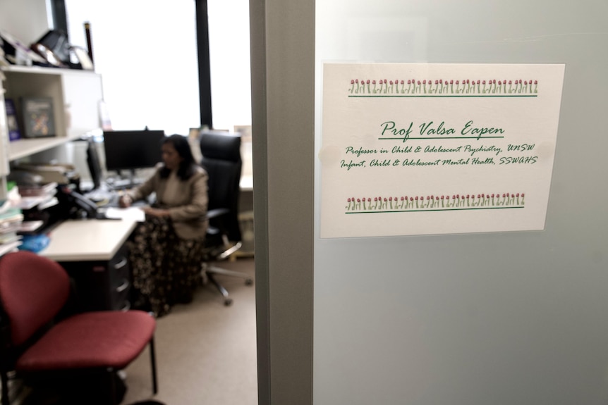 A woman works in her office.