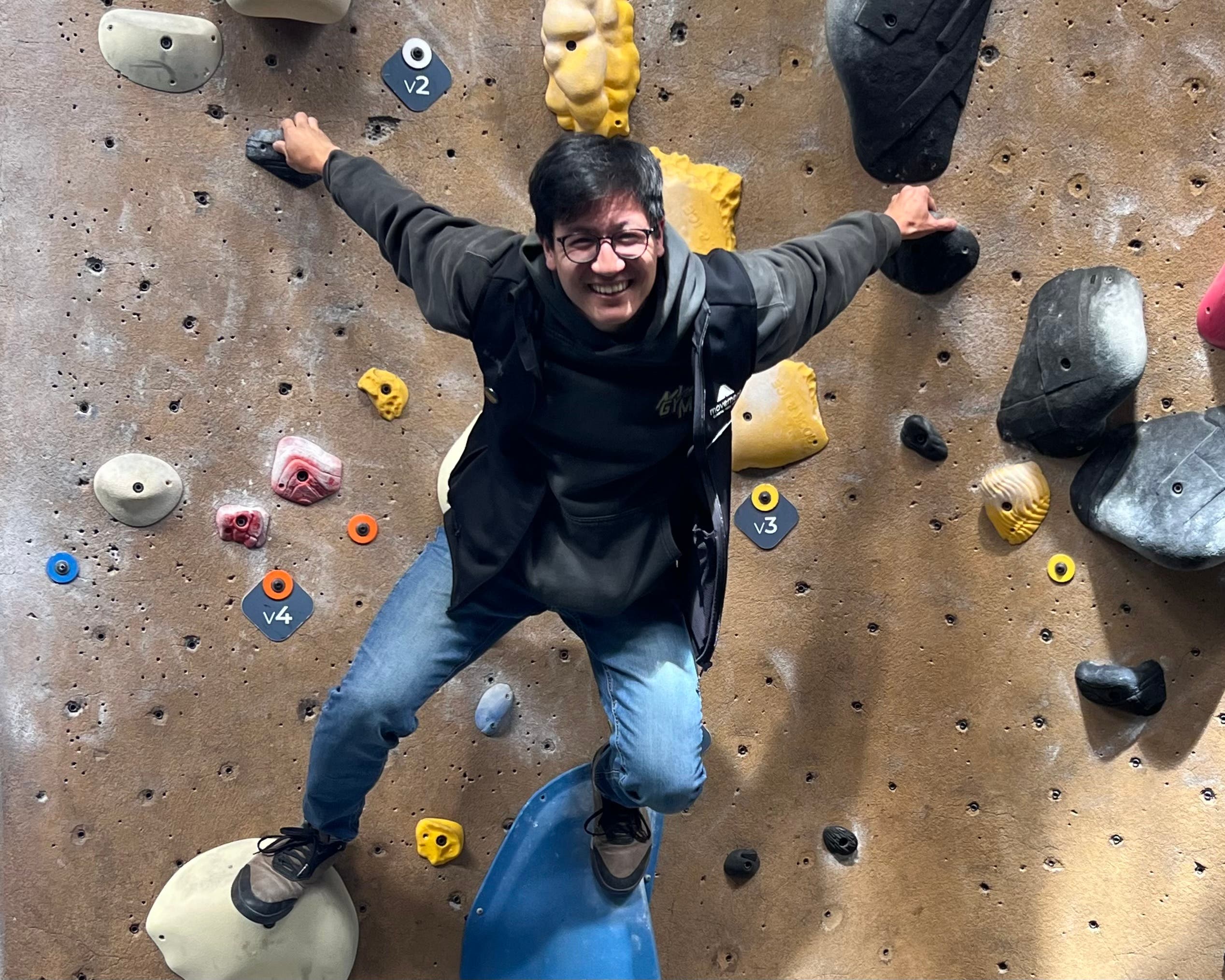 Alex Lin hangs off the wall at Movement San Francisco.