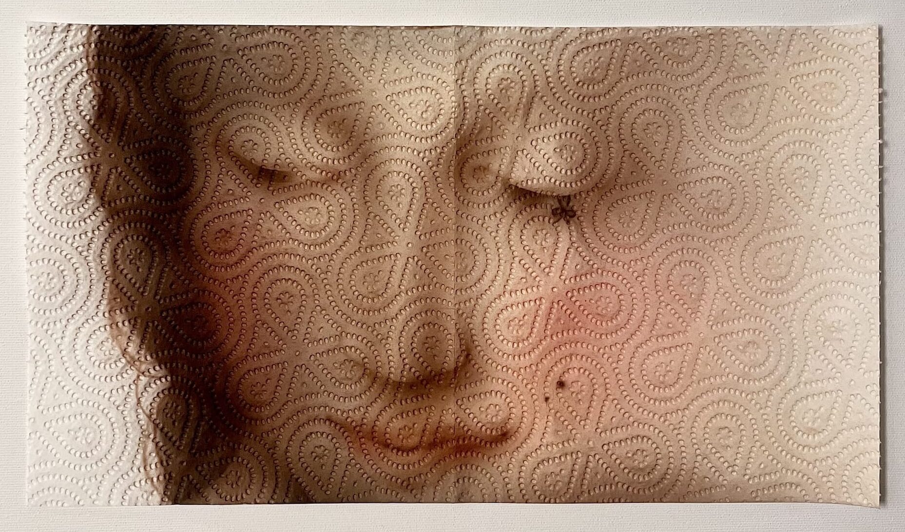 a painting of a woman's face, inspired by a Renaissance portrait, on two sheets of paper towel