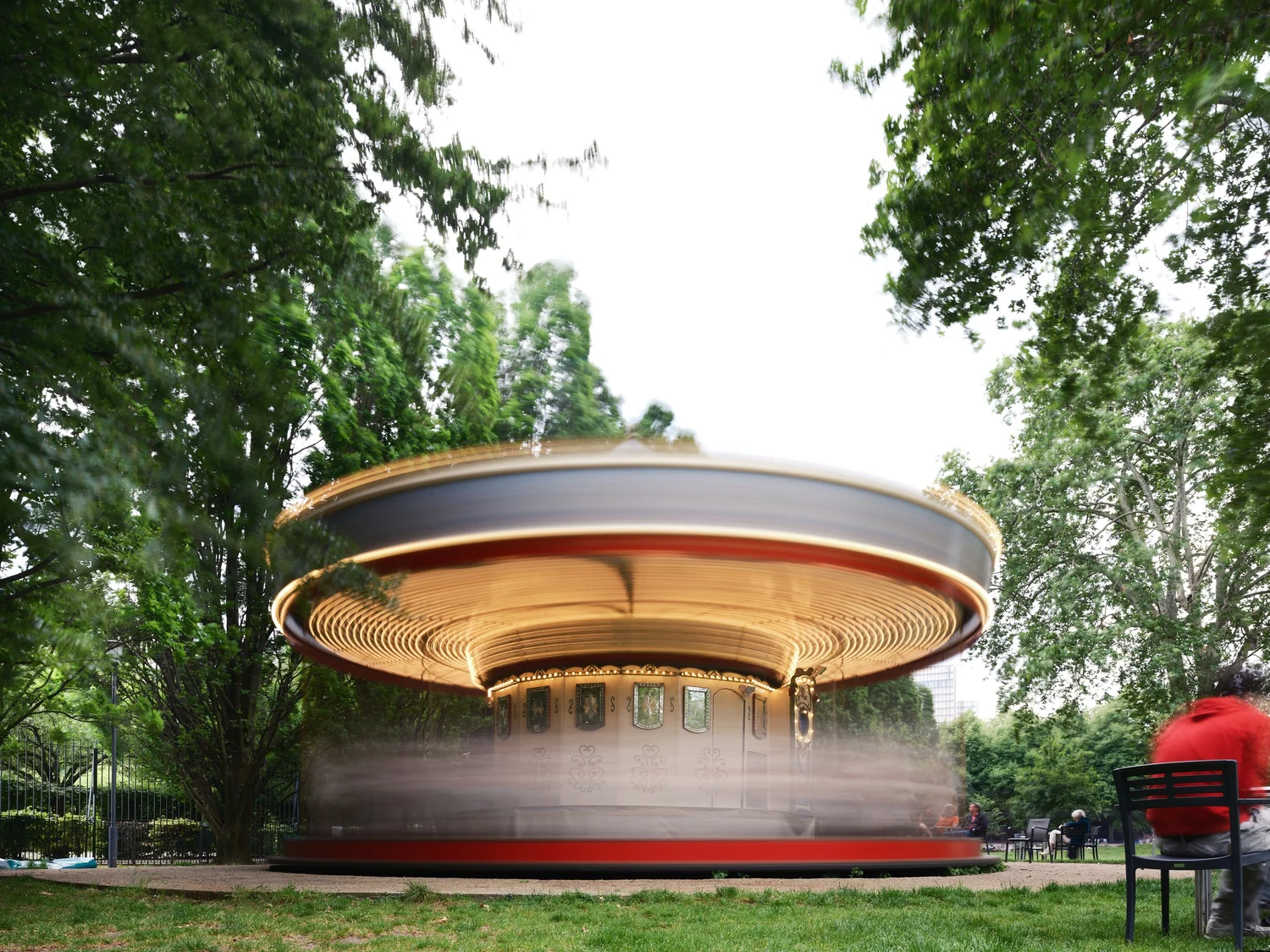 a long-exposure photo of a spinning carousel