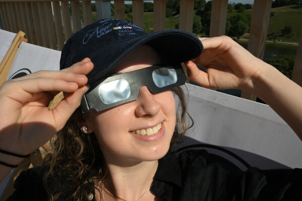 Millions gather in Spain for solar eclipse amid fire alerts