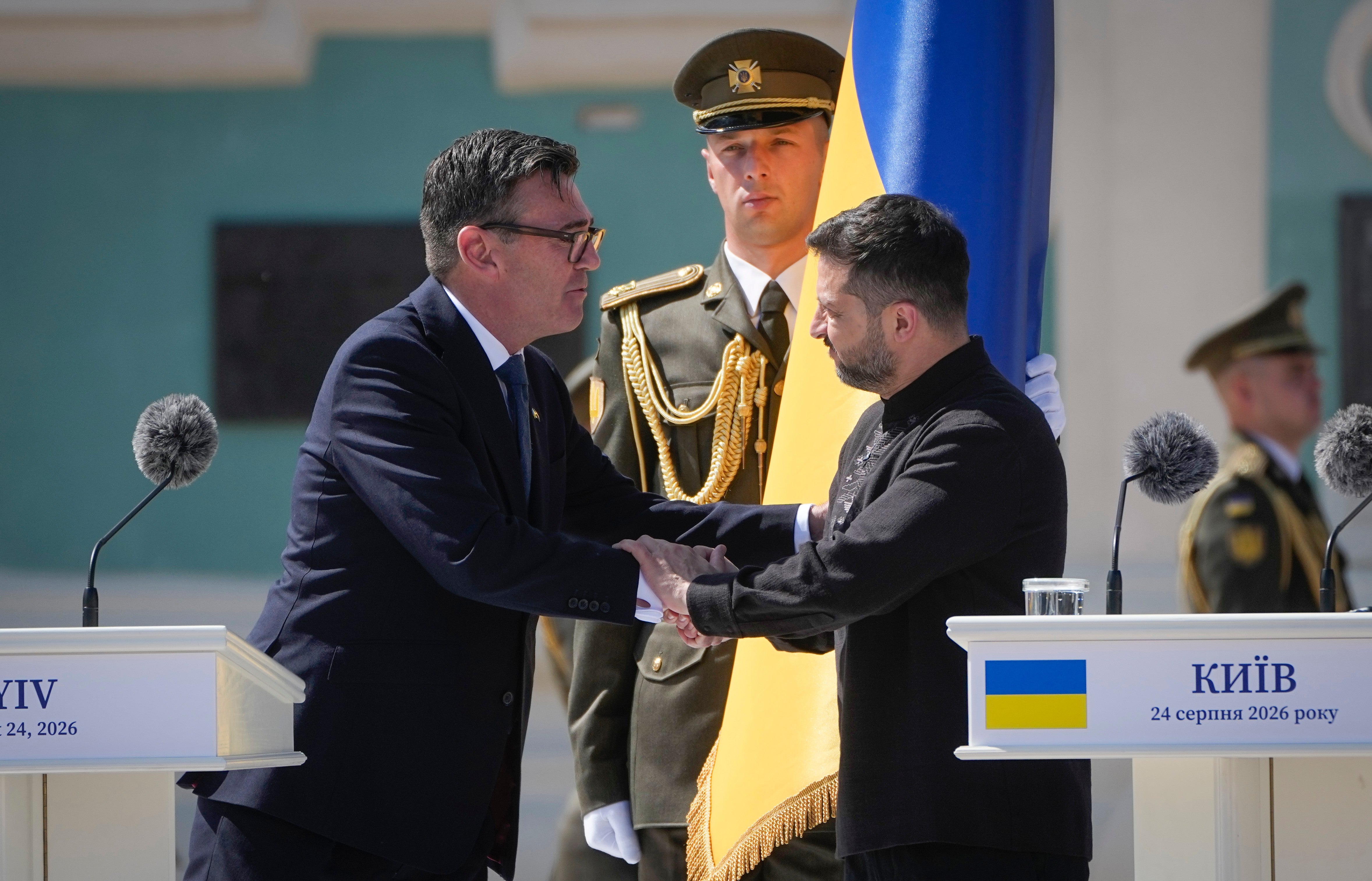 Ukraine's President Volodymyr Zelenskyy, right, greets Britain's Prime Minister Andy Burnham during a ceremony to mark Independence Day in Kyiv, Ukraine, Monday, Aug. 24, 2026