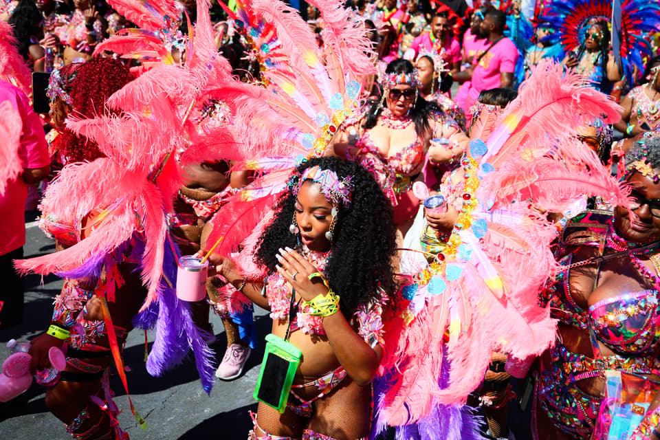 <p>LONDON, ENGLAND - AUGUST 25: Revellers take part in the Notting Hill Carnival on August 25, 2025 in London, England. The Notting Hill carnival was established in 1959 to foster community cohesion after racial violence towards the West Indian migrant population that resulted in murder. Trinidadian human rights activist Claudia Jones organised the first indoor Caribbean Carnival at St Pancras Town Hall, where the event featured music, masques, and calypso performers and was broadcast on the BBC. In 1966, local social worker Rhaune Laslett brought the festival to the street, creating the foundation for the Notting Hill Carnival we know today. The Notting Hill Carnival is Europe's Largest Street festival and remains a community-led event, celebrating Caribbean culture and bringing diverse communities together through Sound Systems, floats, costumes and dancing. (Photo by Alishia Abodunde/Getty Images)</p>
