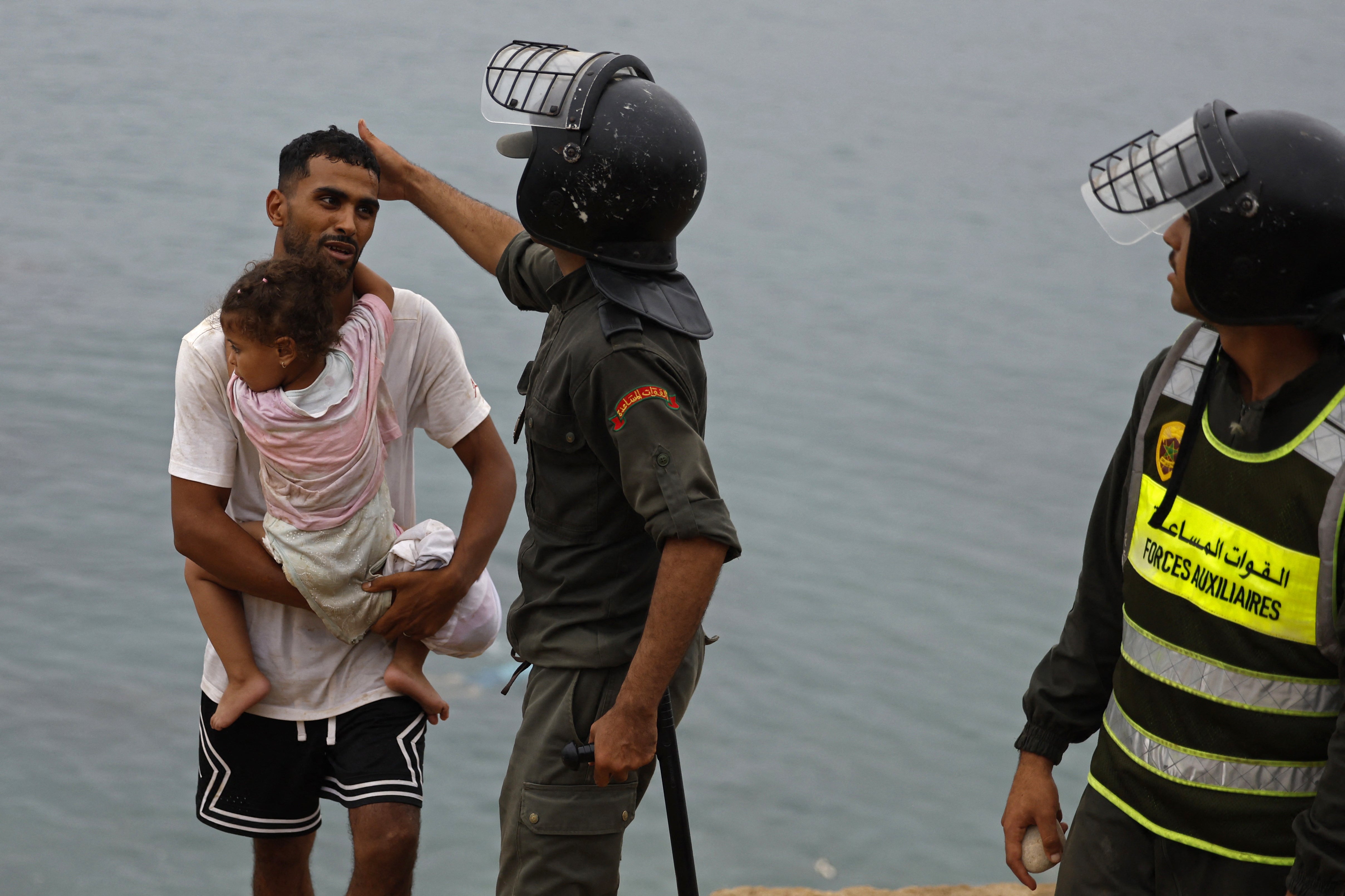 Children were among the crowds trying to make it across the border