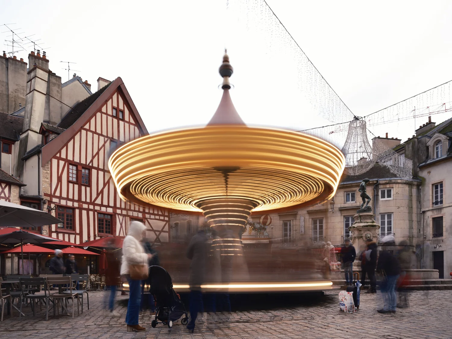 a long-exposure photo of a spinning carousel