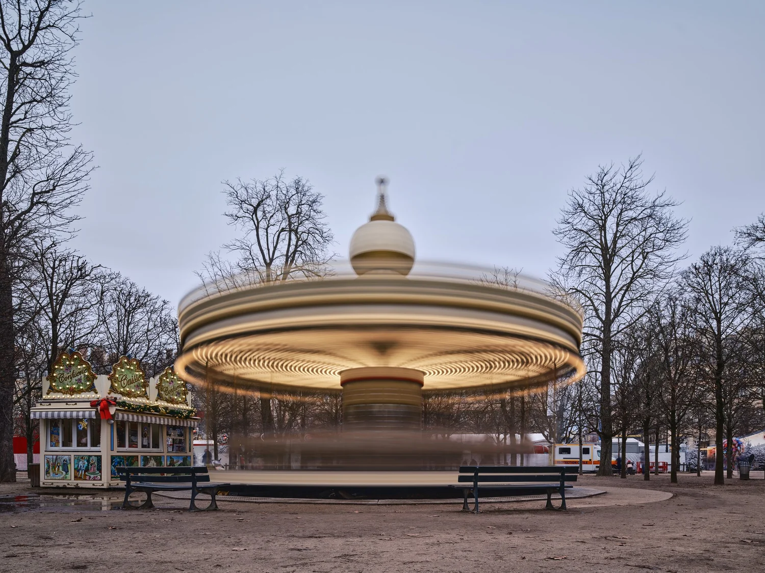 a long-exposure photo of a spinning carousel
