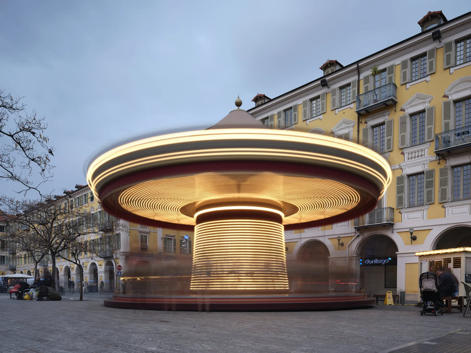a long-exposure photo of a spinning carousel