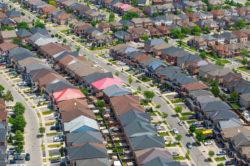 Drone shot of suburban house roofs
