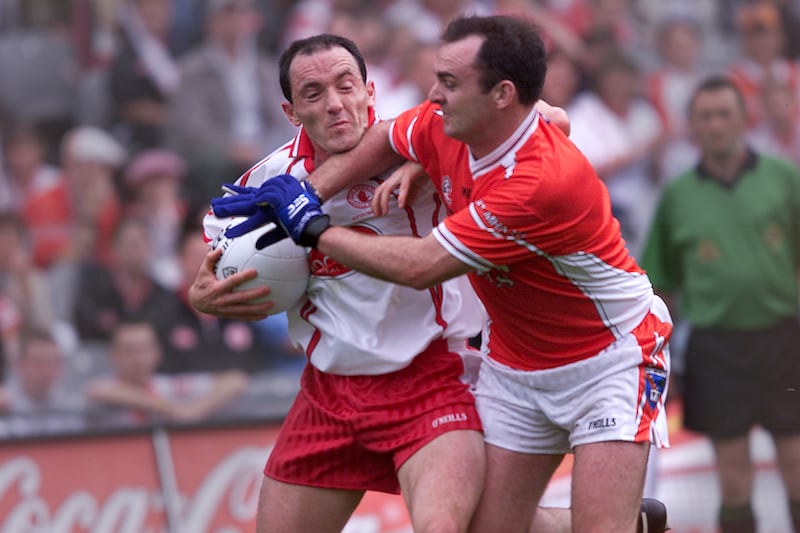 Aidan O'Rourke tackles Brian Dooher