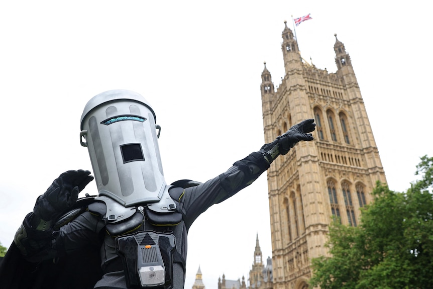A photo of a man with a bin-shaped helmet on.