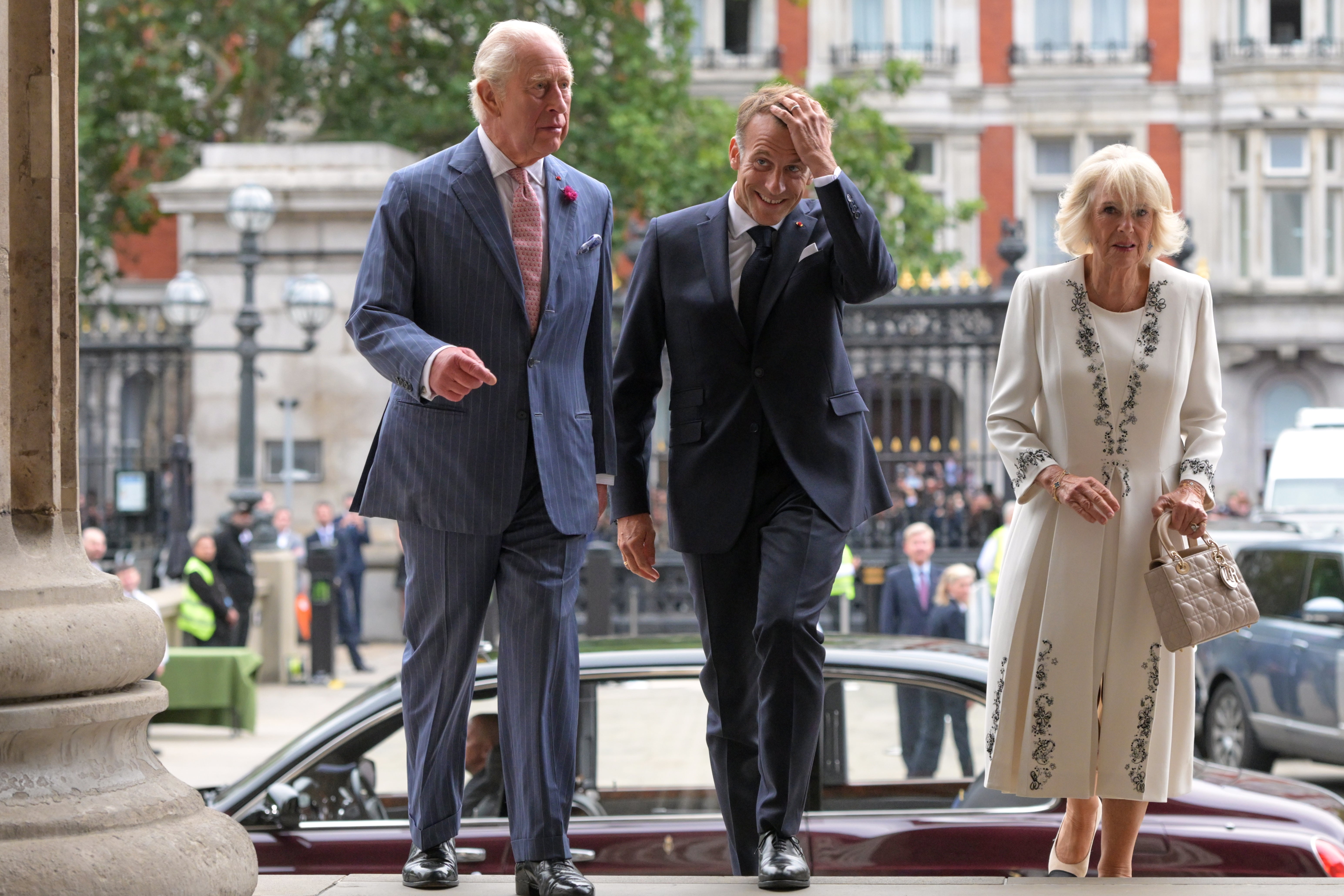 Britain’s King Charles III, Emmanuel Macron, president of France, and Queen Camilla arrive to view the Bayeux Tapestry