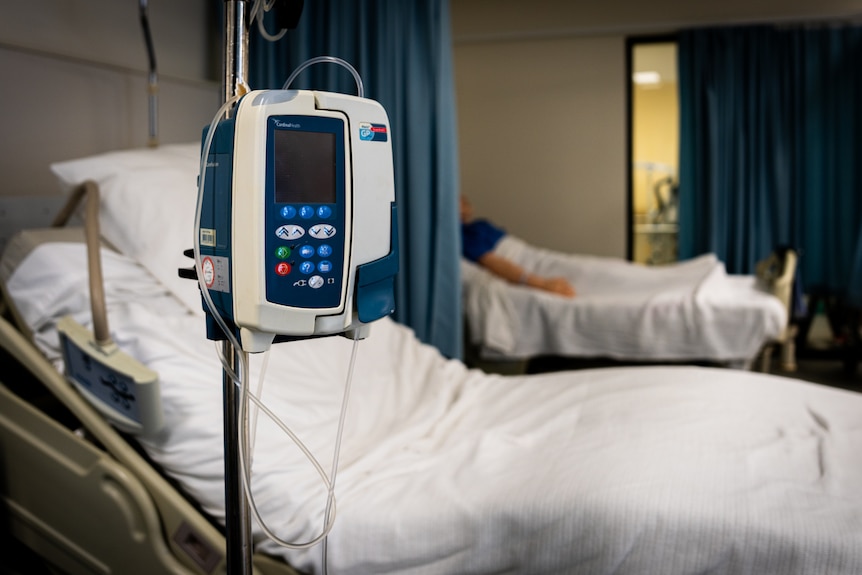Empty bed in a hospital ward.