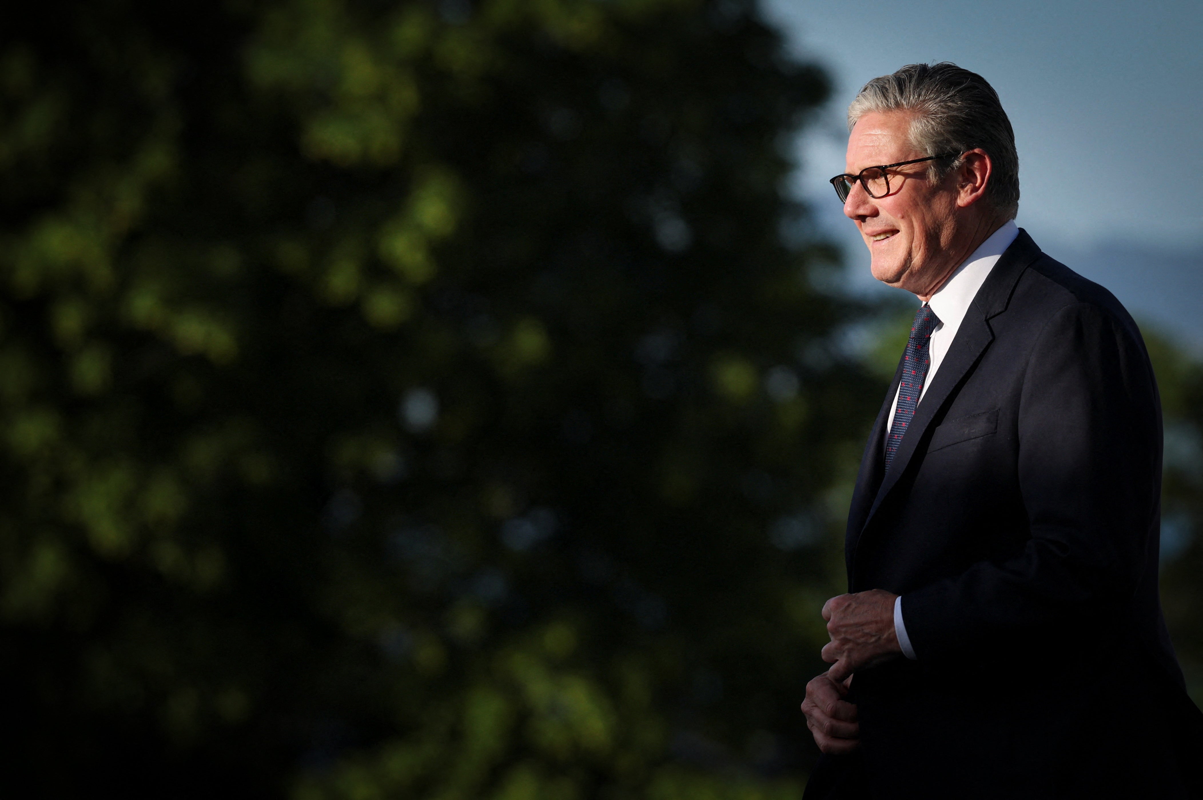 PM Keir Starmer walks during the official greeting as part of the G7 summit in Evian in eastern France
