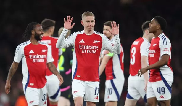 Myles Lewis-Skelly is consoled by Oleksandr Zinchenko after receiving a red card