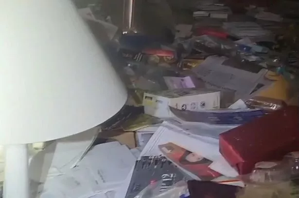 Belongings have piled up at the woman's property