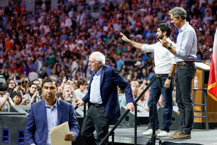 Sen. Bernie Sanders (I-Vt) exits the stage along with former Texas congressman Beto O'Rourke...