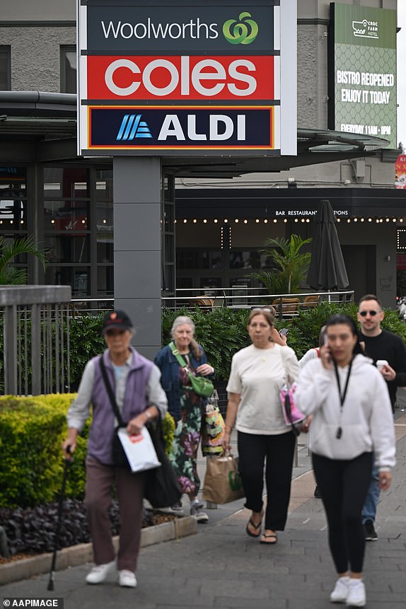 Shoppers walk past signs of Woolworths, Coles and Aldi at a shopping precinct in Ashfield, Sydney, Tuesday, April 8, 2025. (AAP Image/Lukas Coch) NO ARCHIVING