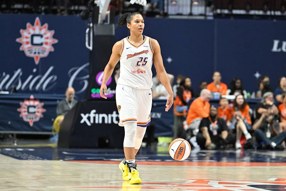 Phoenix Mercury forward Alyssa Thomas dribbles the ball against the Connecticut Sun.Eric Canha-Imagn Images