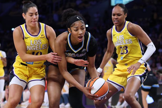 Angel Reese #5 of the Chicago Sky reacts as she is guarded by Azura Stevens #23 and Kelsey Plum #10 of the Los Angeles Sparks during the first half at Crypto.com Arena on June 29, 2025 in Los Angeles, California