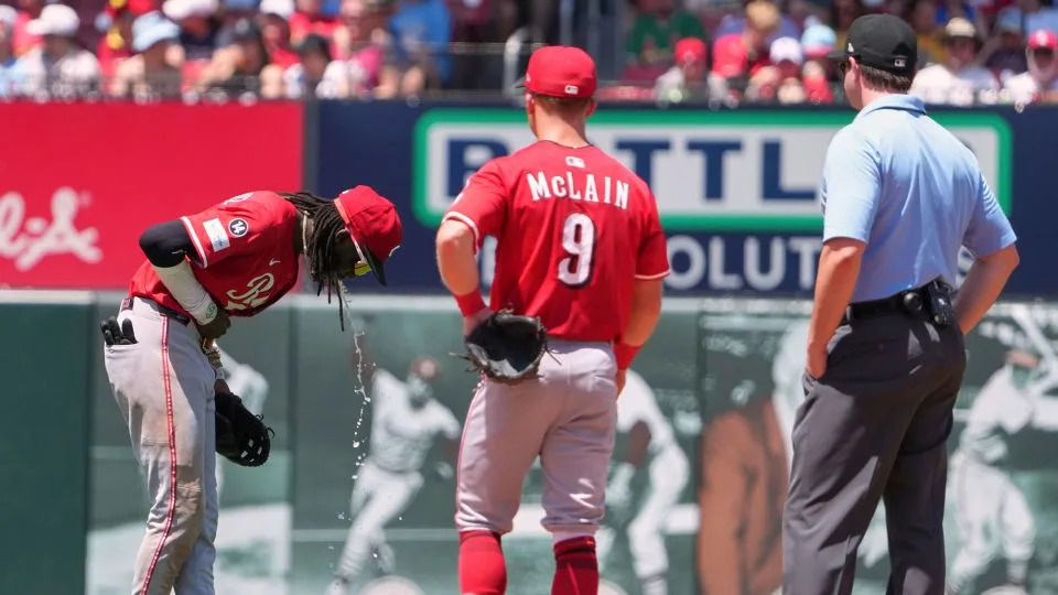 Cincinnati Reds shortstop Elly De La Cruz vomits during the fourth inning at Busch Stadium. - Jeff Roberson/AP